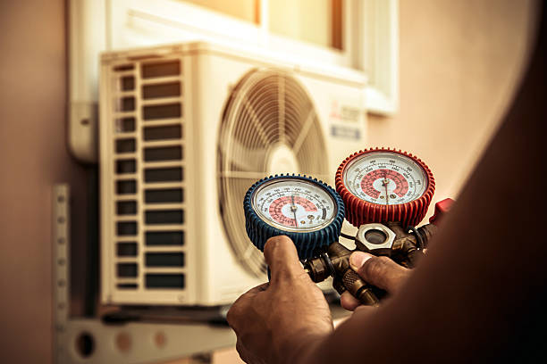 Professional Heat Pump Repair technician working in Sharpsburg, KY